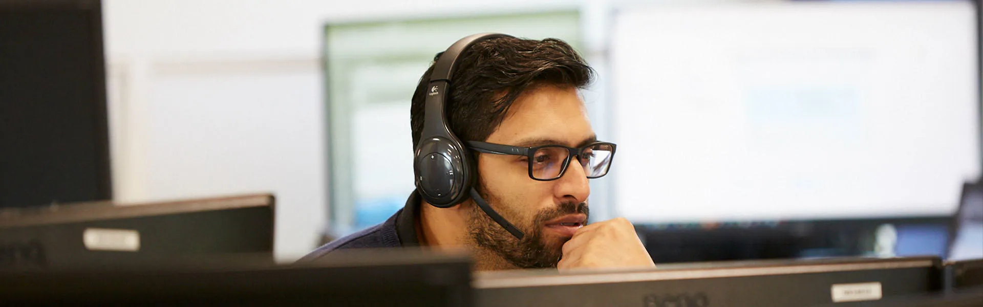 A Sunbelt employee speaking via a headset
